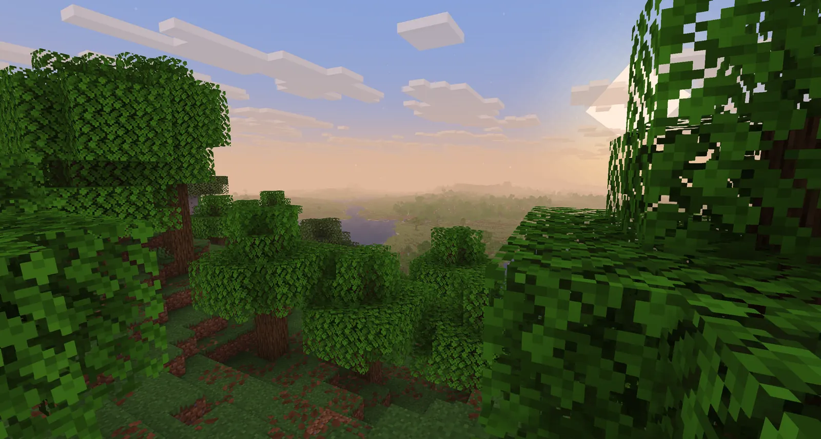 Bright Minecraft mountain and river landscape rendered with a lightweight basic shader effect
